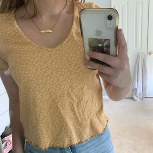 yellow and white floral american eagle shirt